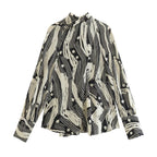 Monochrome Muse – Abstract Tie-Neck Blouse