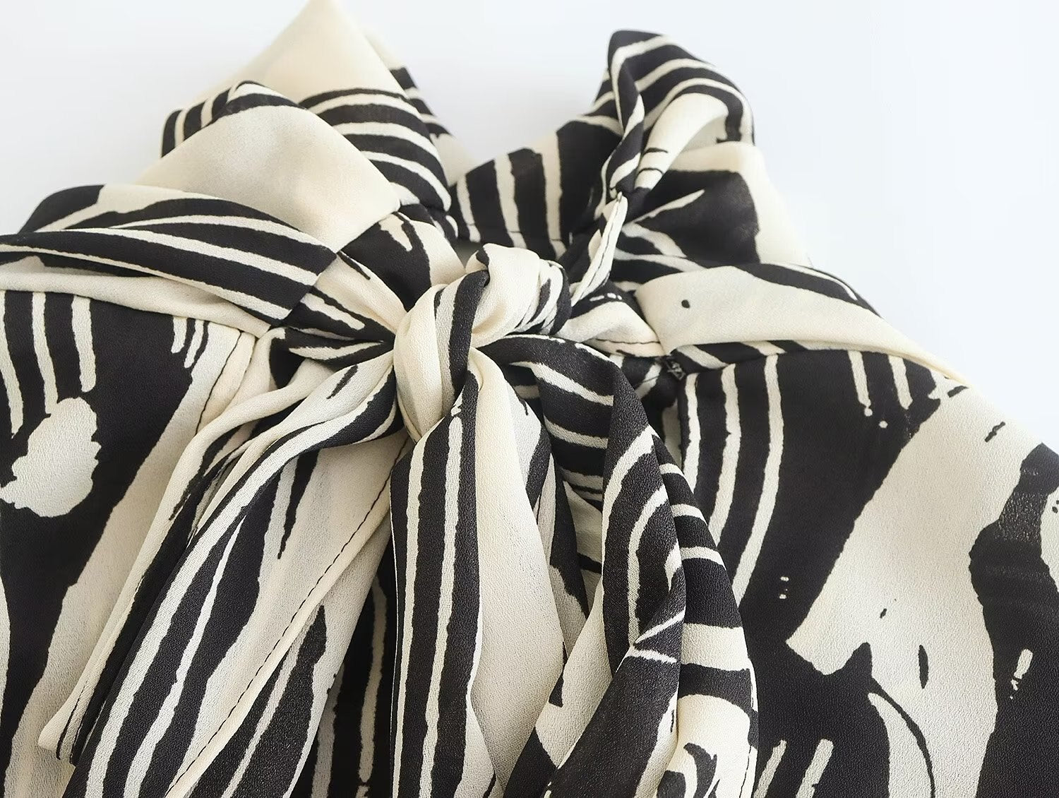 Monochrome Muse – Abstract Tie-Neck Blouse