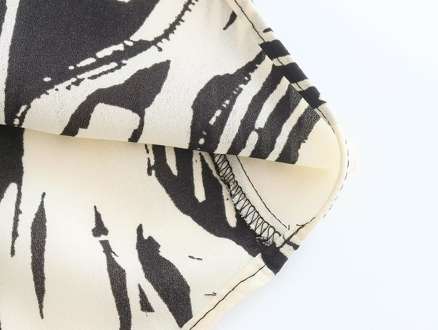 Monochrome Muse – Abstract Tie-Neck Blouse