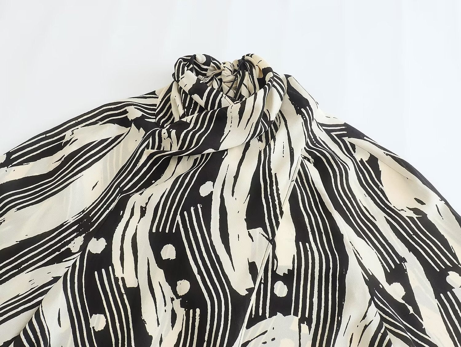 Monochrome Muse – Abstract Tie-Neck Blouse